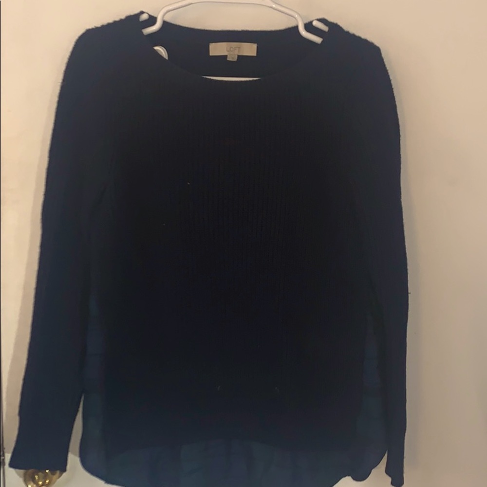 Navy blue sweater with a plaid underlay